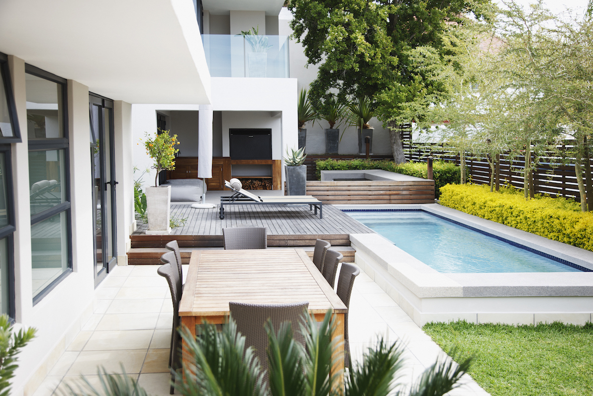 Outdoor Entertainment Area in Auckland Central with an inground pool, deck and paved outdoor seating area.