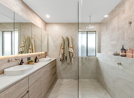 shower with glass protection and double sink under mirror with LED lights