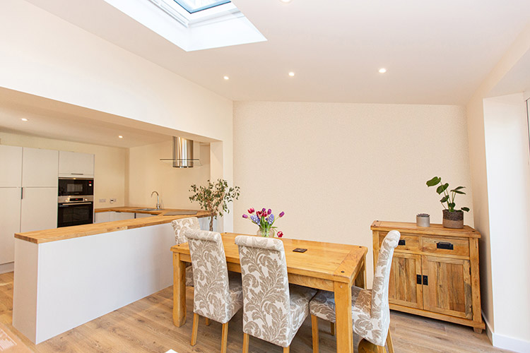 house extension in Cambridgeshire with wood top and featuring a wood dining table