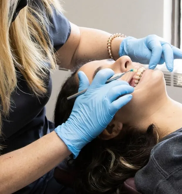 Orthodontist looking inside a patients mouth