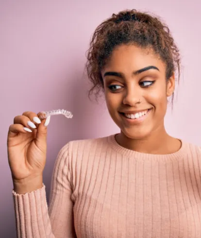 Women holding a retainer looking at them