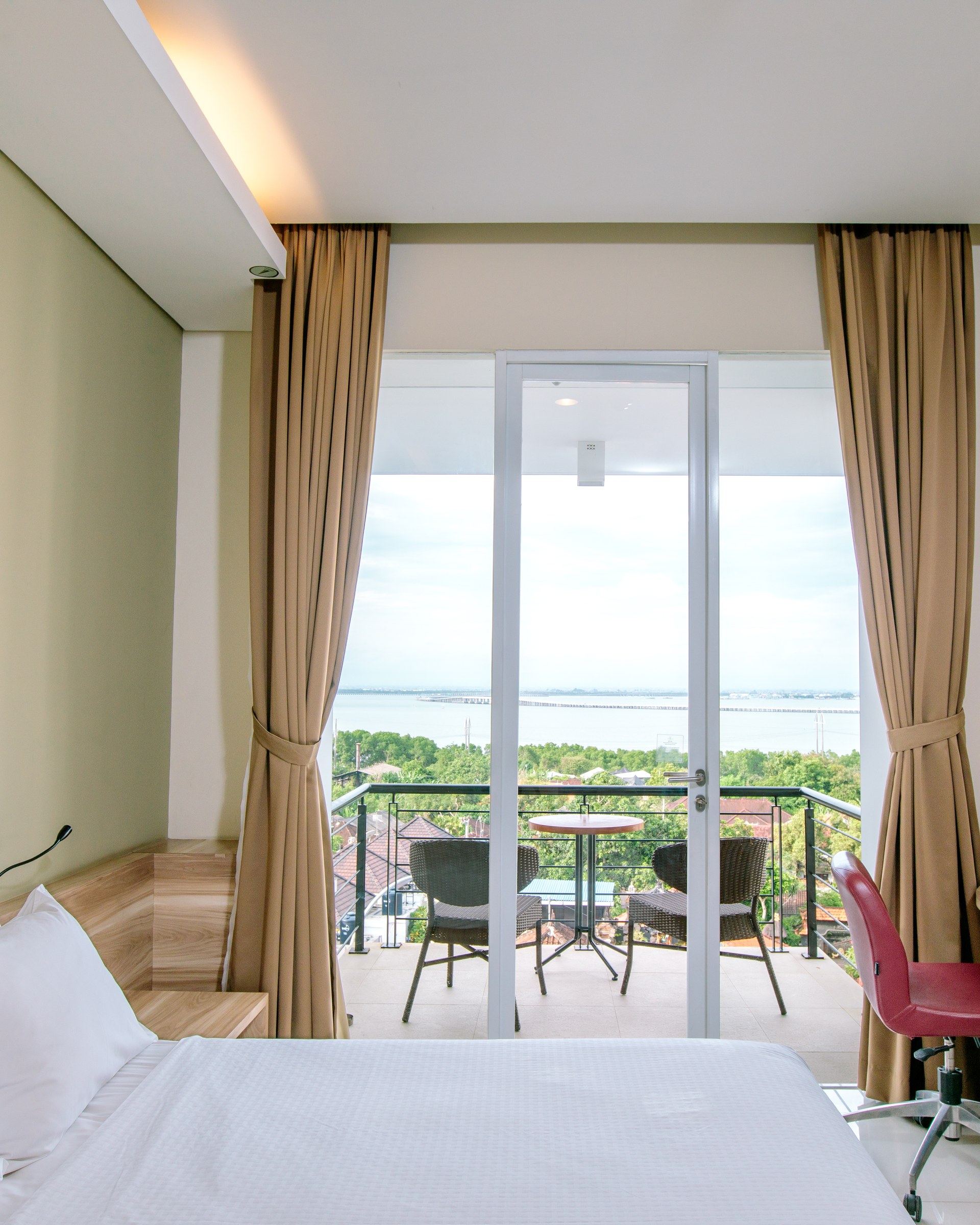 Deluxe Room balcony with Bali bay view at Mahogany Hotel Nusa Dua