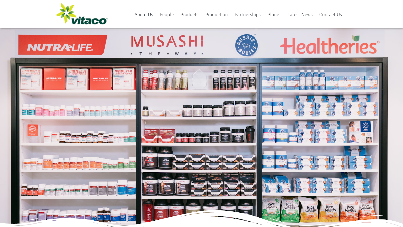 A screenshot from the Vitaco website, showing shelves full of their products.