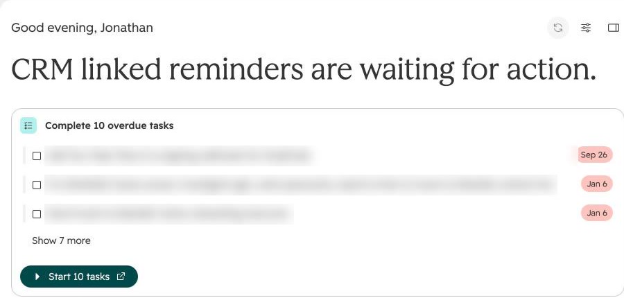 HubSpot home with a generated headline and a Start 10 tasks button (task names blurred).