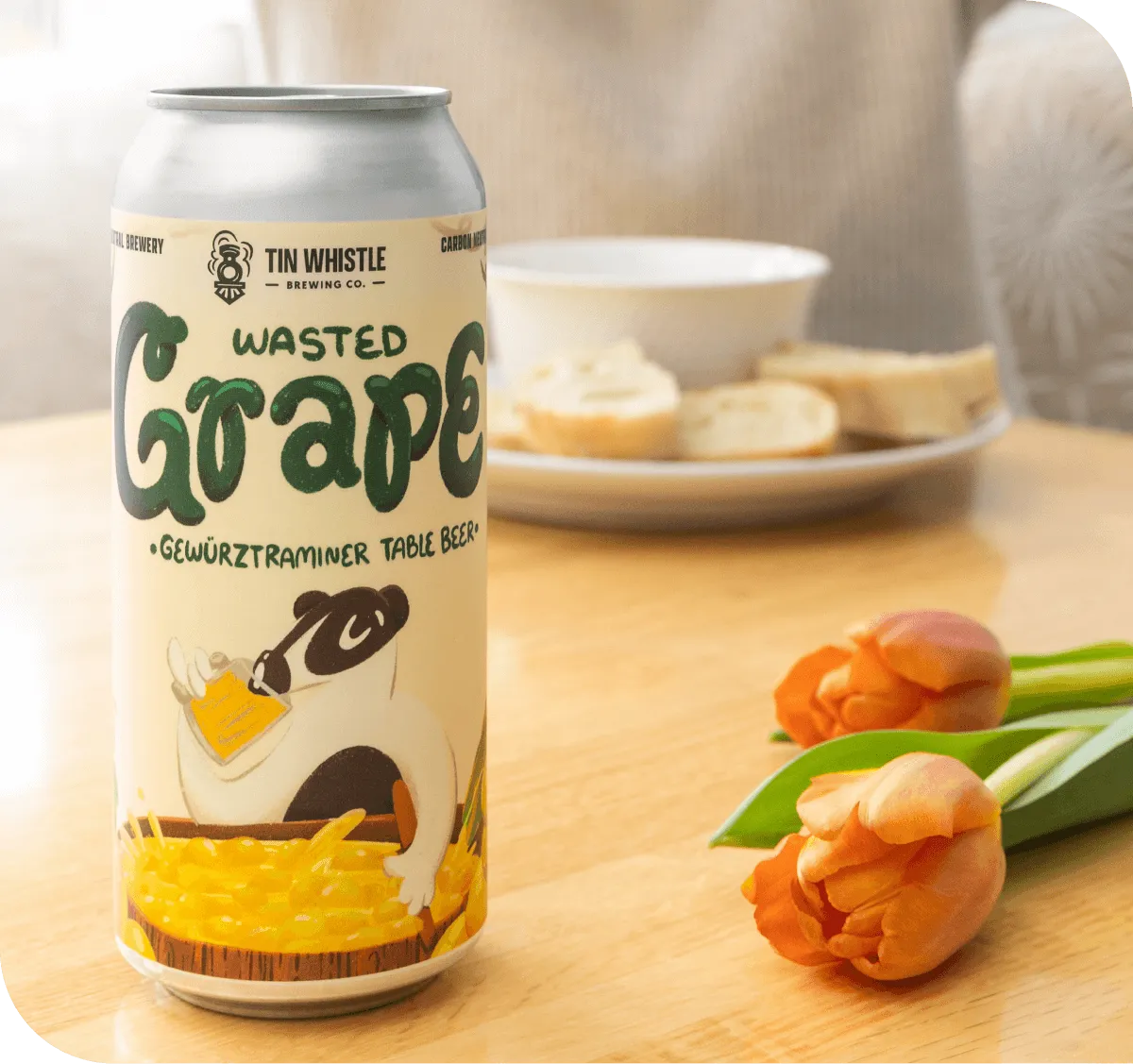 Wasted Grape beer can and tulips on a table