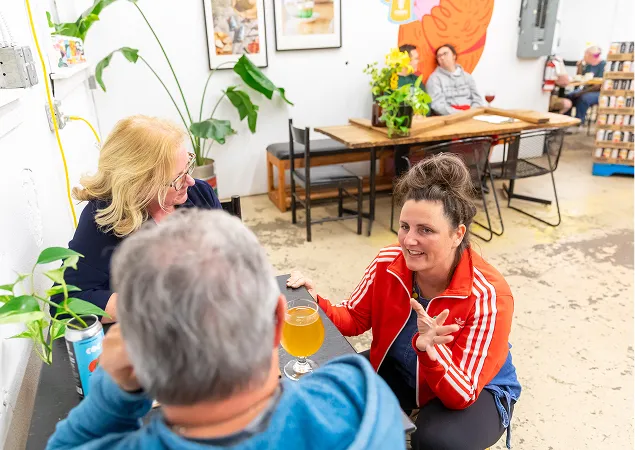 People talking in Tin Whistle taproom
