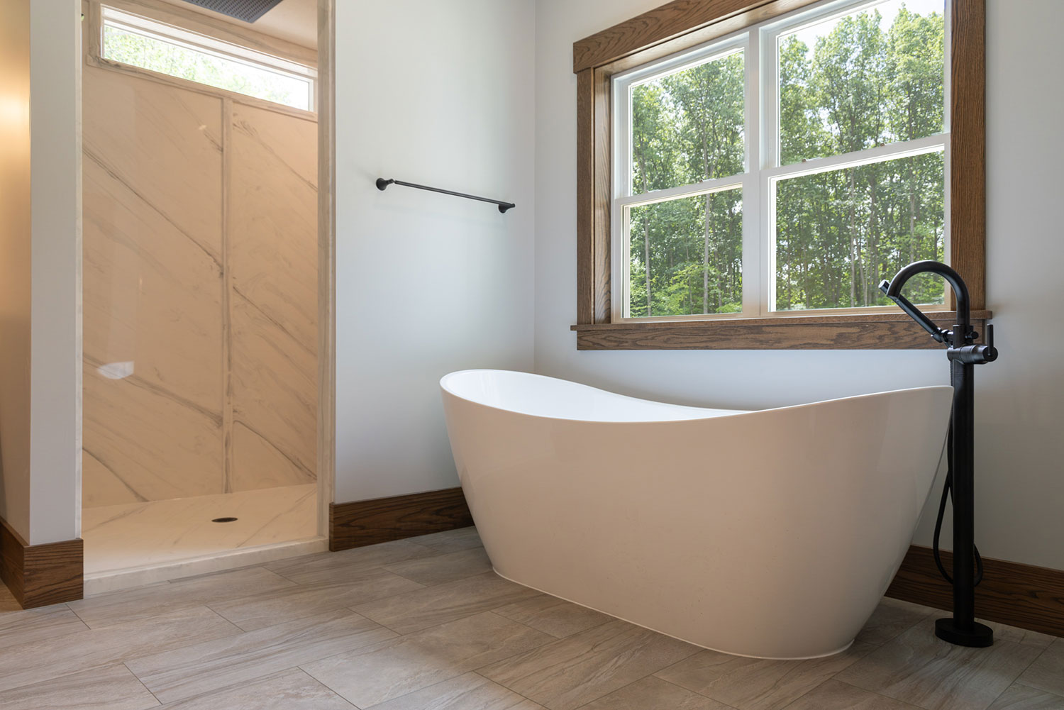 Set against a peaceful wooded backdrop, this four-bedroom, two-and-a-half-bath home blends timeless character with bright, open living. 