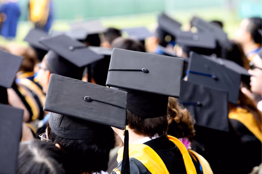 A photo of a graduating class in their cap and gowns