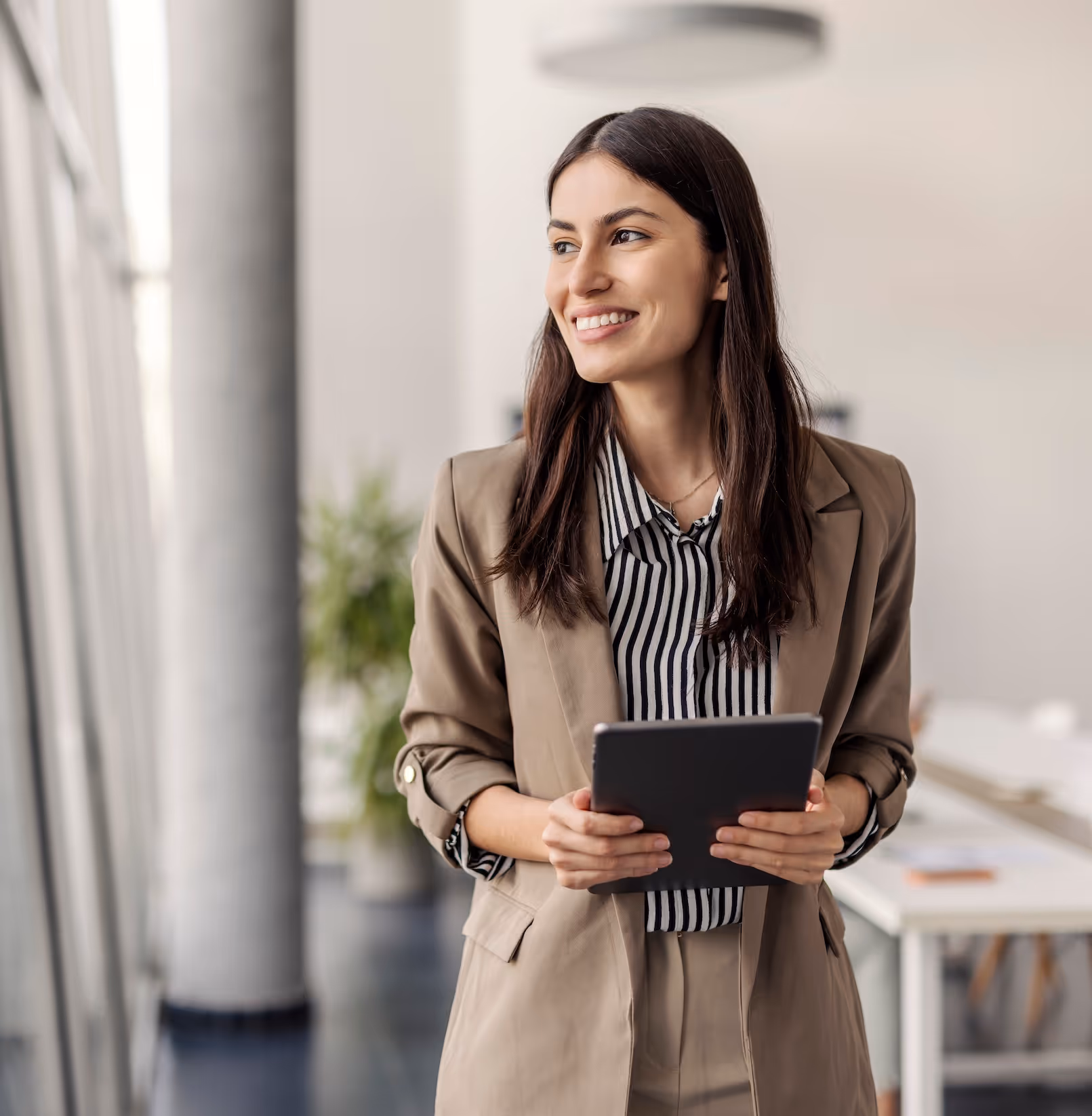 A business woman holding an iPad