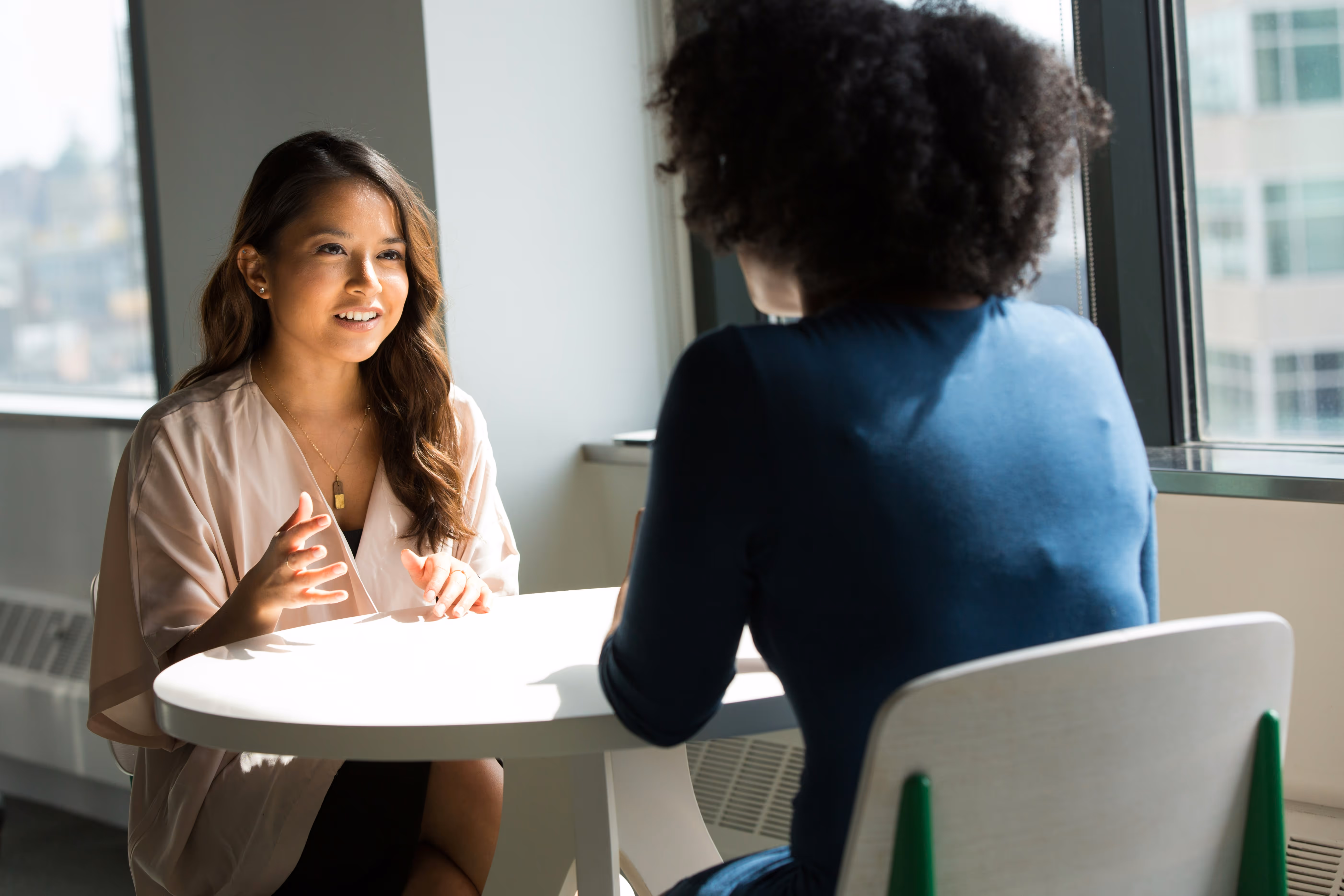 A business meeting between two women