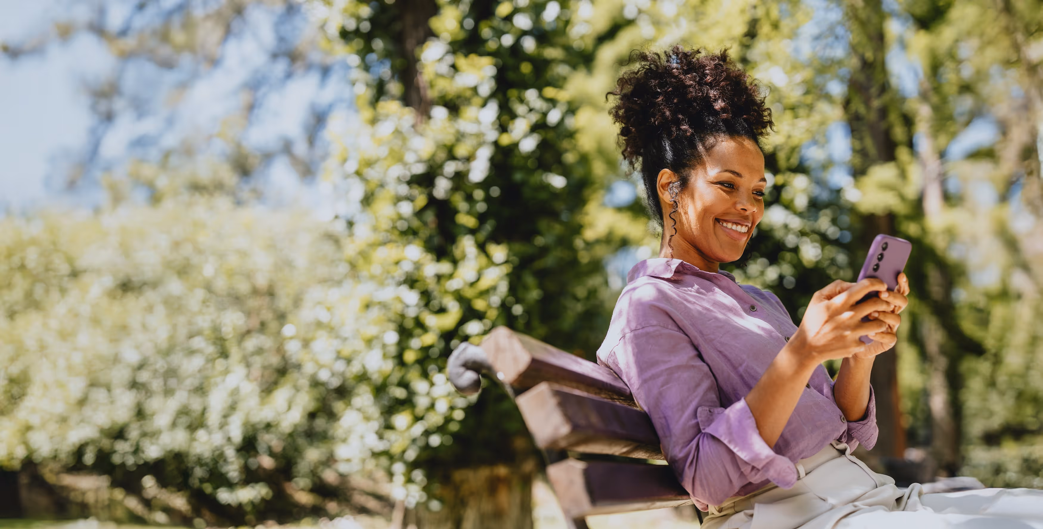 A woman sitting on a park bench