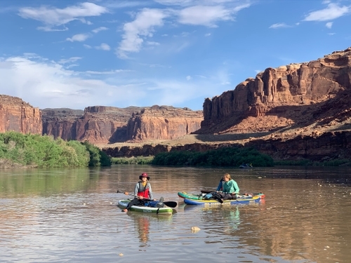 paddleboarders on the water in labyrinth canyon