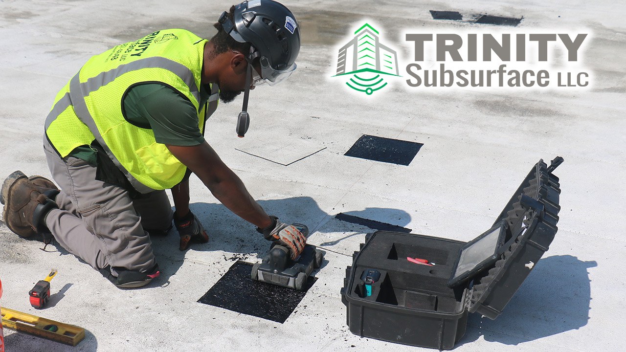 Technician performing concrete scanning on a slab