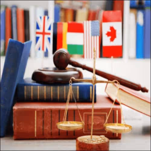 Books, scales, gavel and flags from different countries 