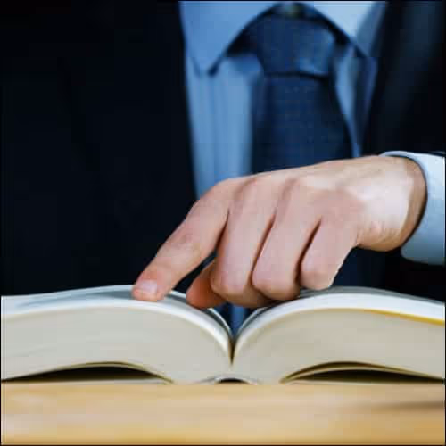 Man reading through book