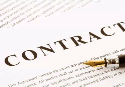 Image of a business contract with a pen