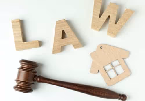 Image of wooden letters that spell law and an image of a wooden house