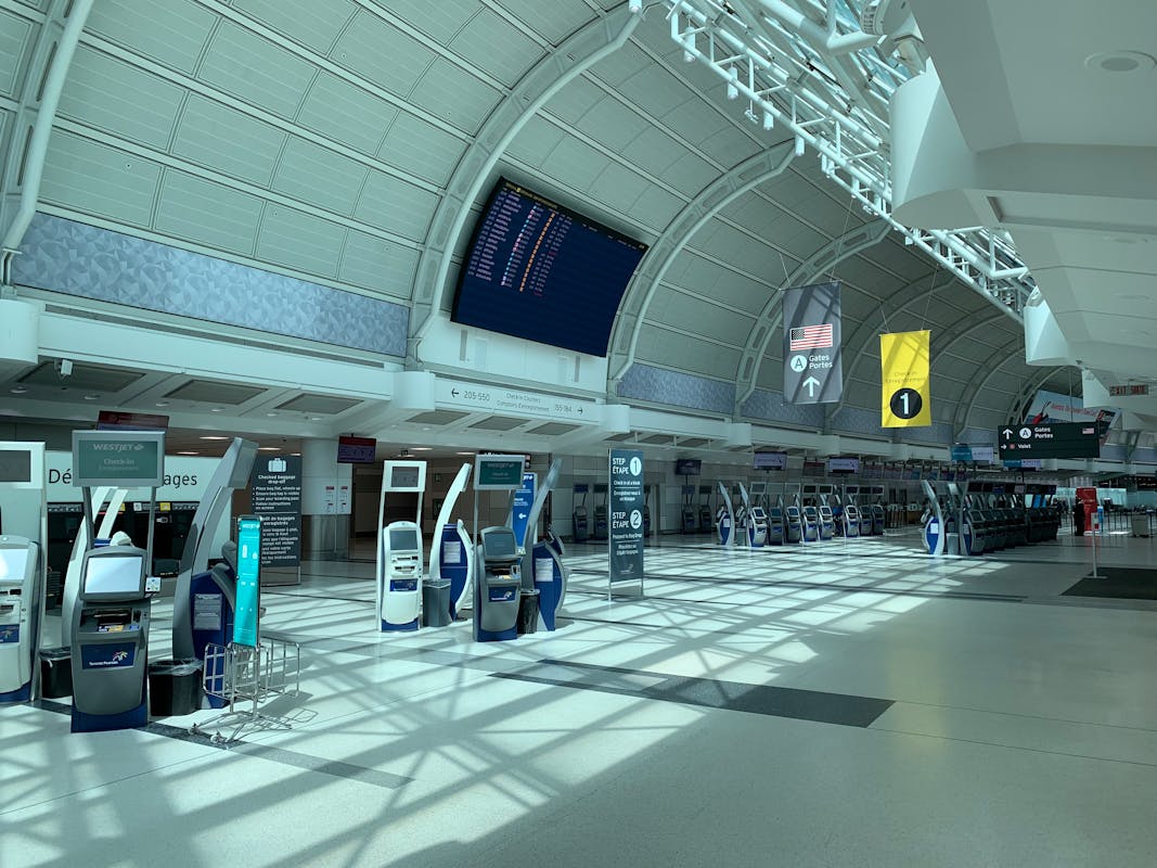 truDigital digital signage at a modern airport showing departure information to transportation industry travelers