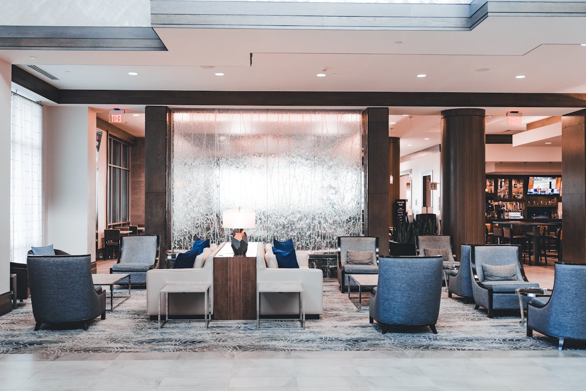 truDigital digital signage welcoming hotel guests in a modern multi-property hospitality lobby check-in area