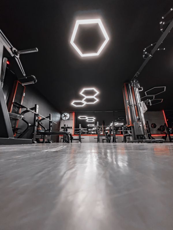 truDigital digital signage display in a modern gym interior guiding members across a fitness studio floor