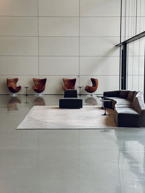 truDigital digital signage in a government office lobby with modern waiting area seating and glass walls