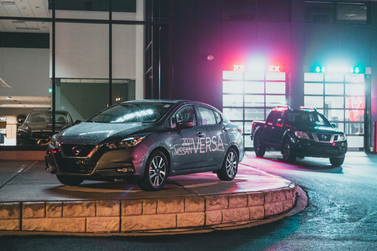 truDigital digital signage for auto dealerships outside a modern car showroom with vehicles on display