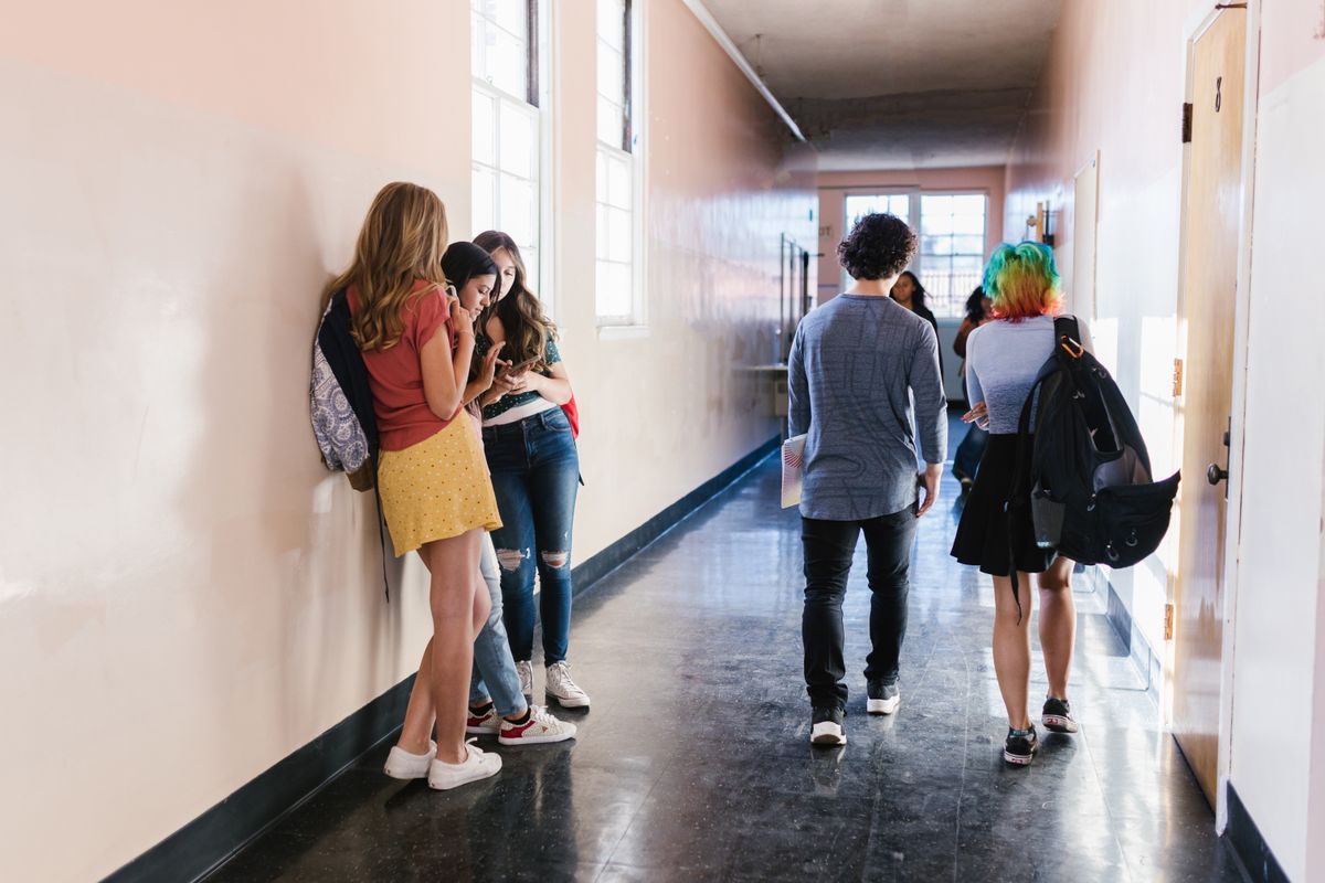 truDigital digital signage in a school hallway as students walk between classes on a K-12 campus