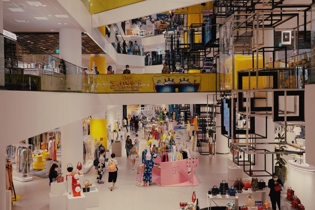 truDigital digital signage displays in a busy multi-level retail shopping center filled with shoppers