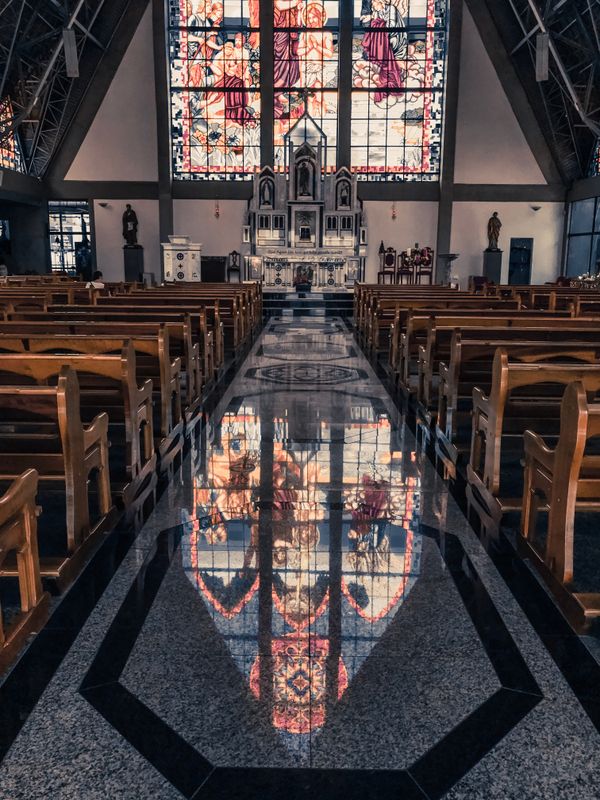 truDigital digital signage in a modern church sanctuary with stained glass reflections