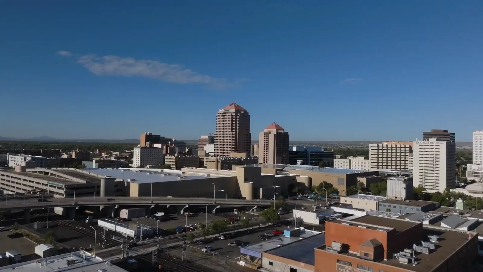 Aerial view of downtown Albuquerque under a clear blue sky