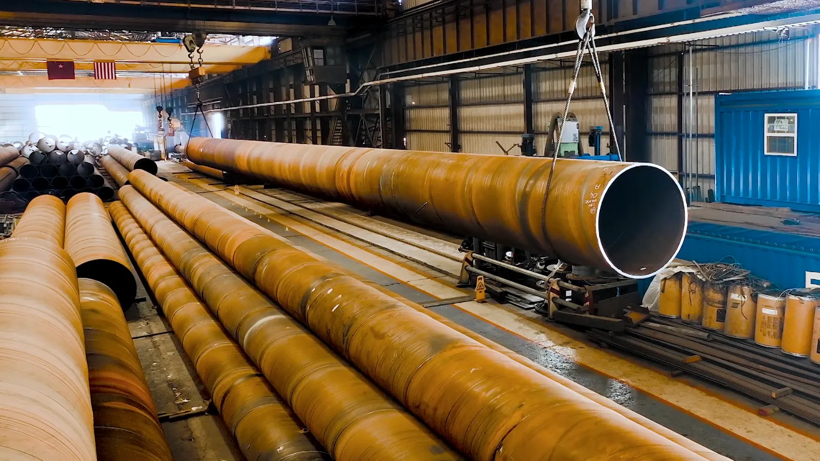 Stacked spiralweld steel pipe inside the Fields HDM mill