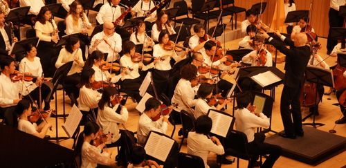 Community Orchestra playing in a concert.