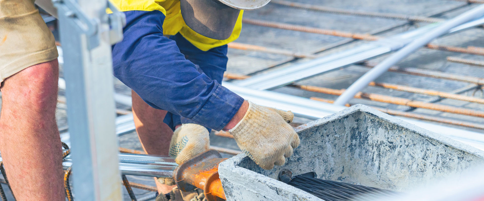 A trade worker laying cables