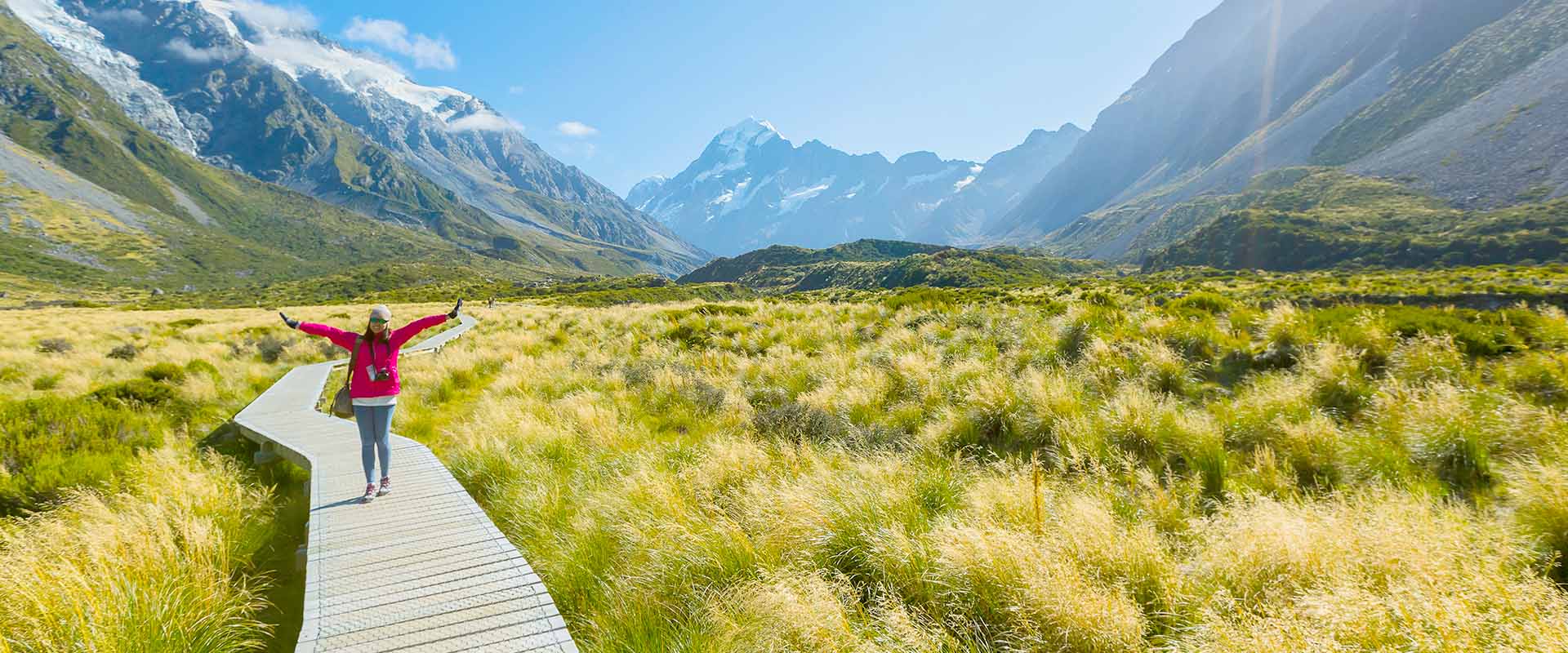 A woman standing in a New Zealand landscape