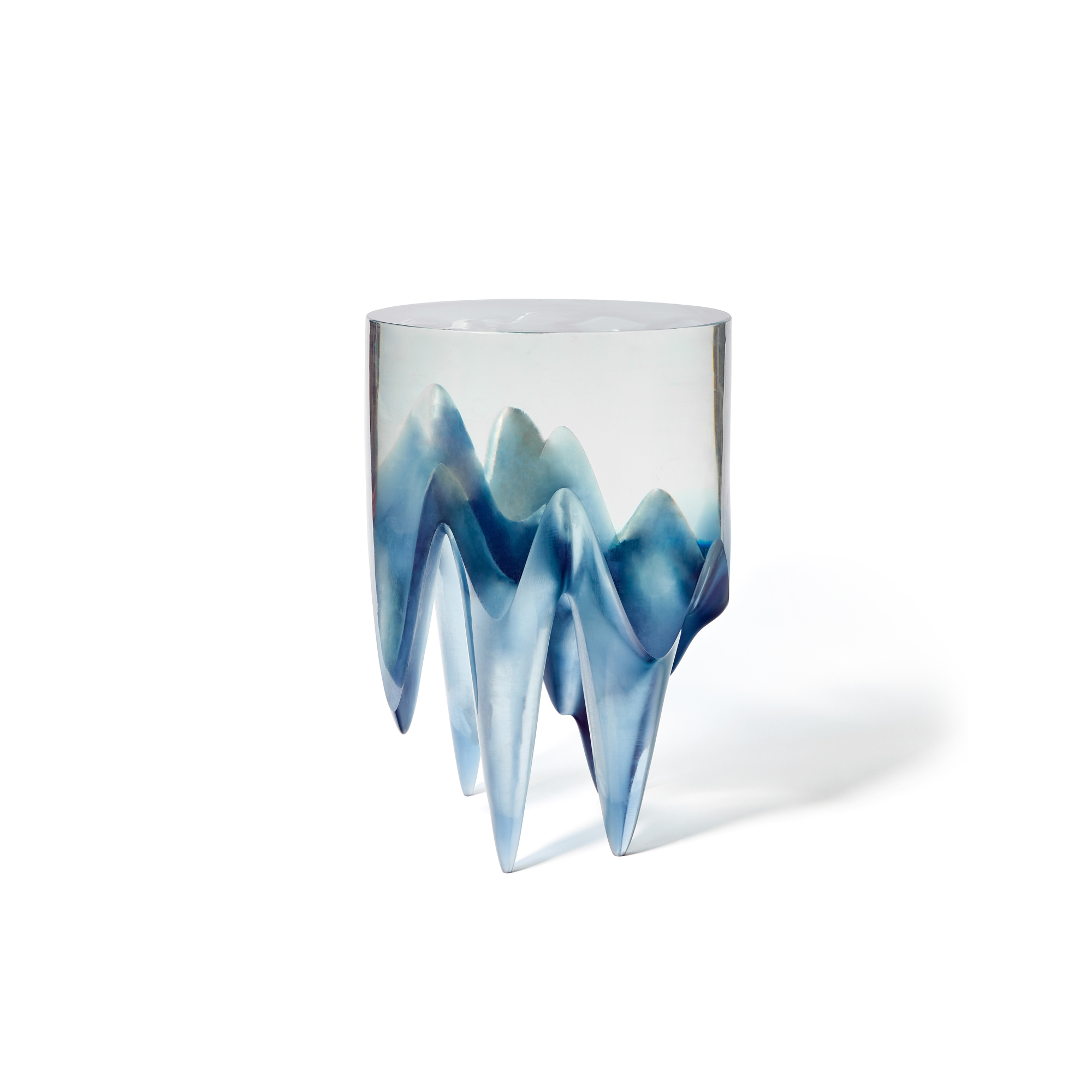 This cast resin Dark Matter end table blurs the line between landscape and light, pulling glacial forms up from another dimension. For sound to exist, vibrations of atoms and molecules must travel through a medium such as air or water. Since molecules do not exist in vast regions of the universe, sound cannot travel through deep space. This has not stopped scientists at NASA from using audio clips to recognize subtle differences in how stars travel and how the sun’s magnetic field fluctuates. This procedure, known as sonification, is recognized among heliophysicists, astrophysicists, and doctors. Sonification is used to visualize sound data, such as the beep from a heart rate monitor, a door bell ringing, or in this case, when stars come into contact with a black hole. I converted ‘Boom’, an audio clip from NASA’s public domain, into a visual soundscape. I then further abstracted ‘Boom’ by manipulating it into shapes and surface textures for the Dark Matter Series. 