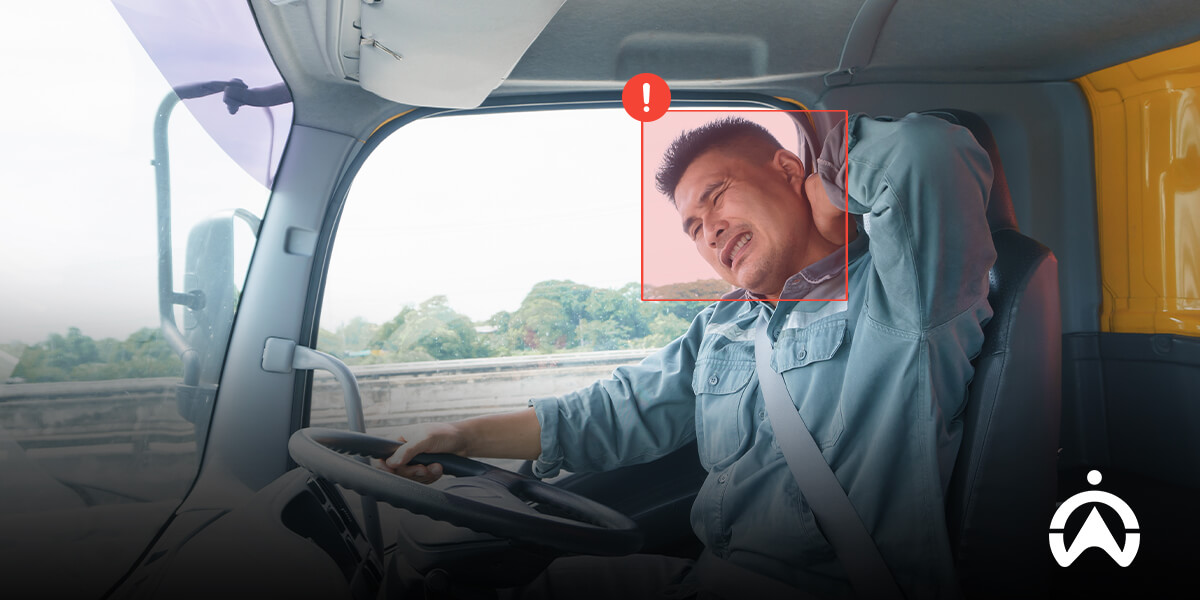 Cartrack driver scorecards with truck driver at wheel and warning symbol over foggy landscape.