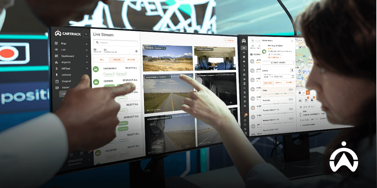 A user navigates Cartrack's live streaming interface on a monitor, showcasing multiple camera feeds and navigation options.