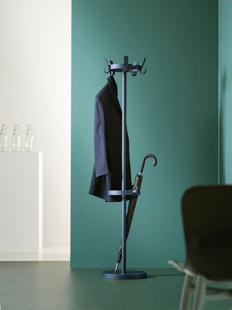 Minimalist white dining area with modern bench seating and large windows, showcasing Functionals furniture in a clean, organised home interior.