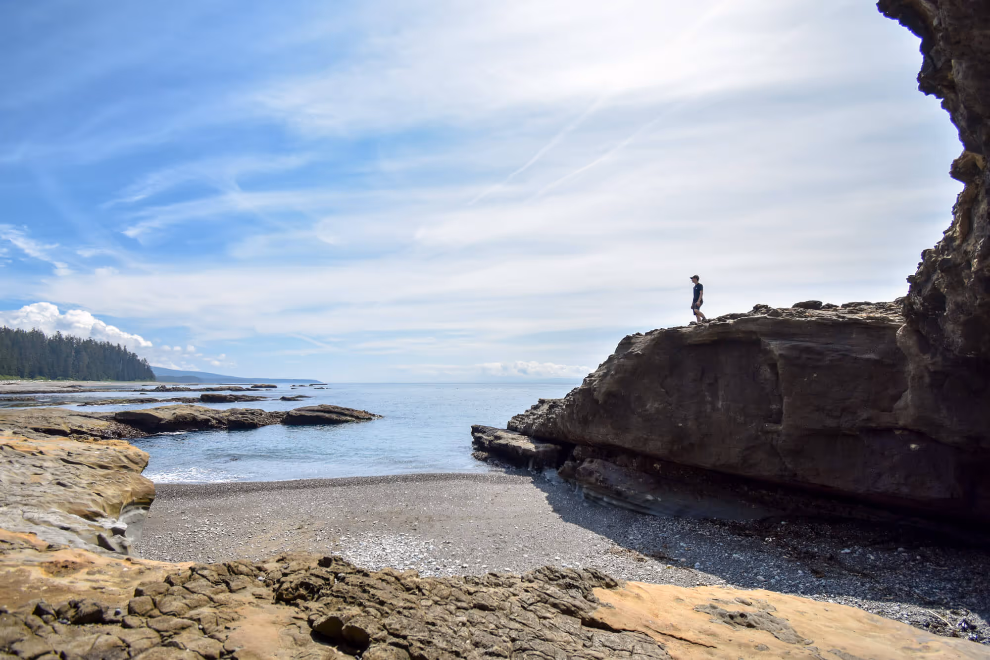 Silhouette of Chris standing on the rock at tsusiat point