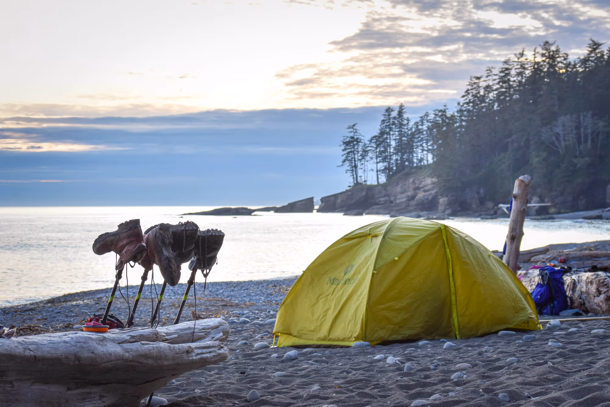 yellow tent on the beach at tsusiat falls on west coast trail