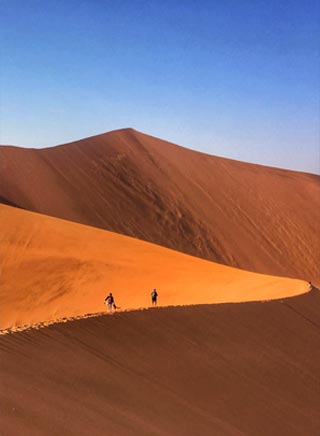 Guests climbing Big Daddy dune in Sossusvlei