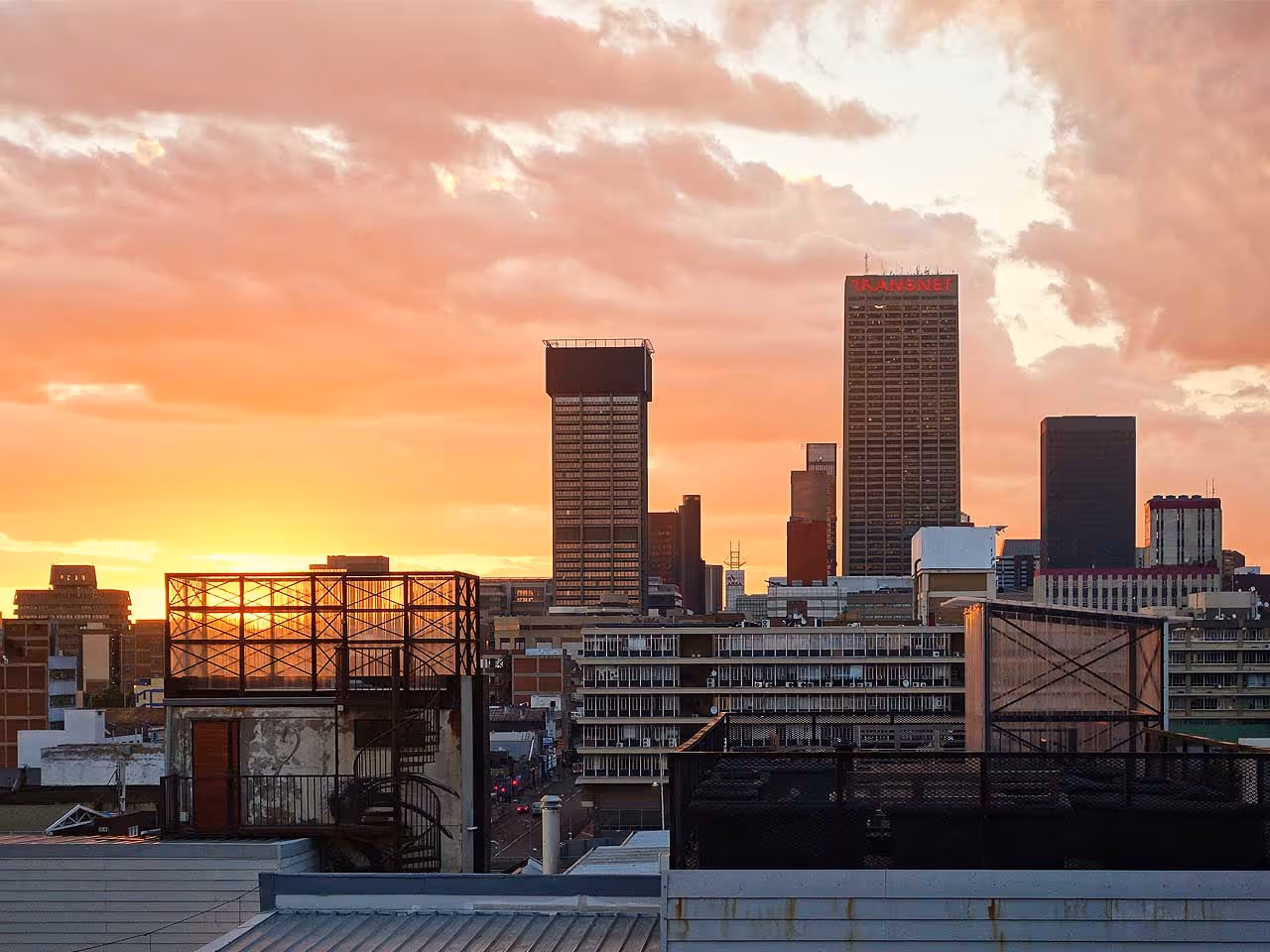 The skyline of Sandton's skyscrapers at sunrise.