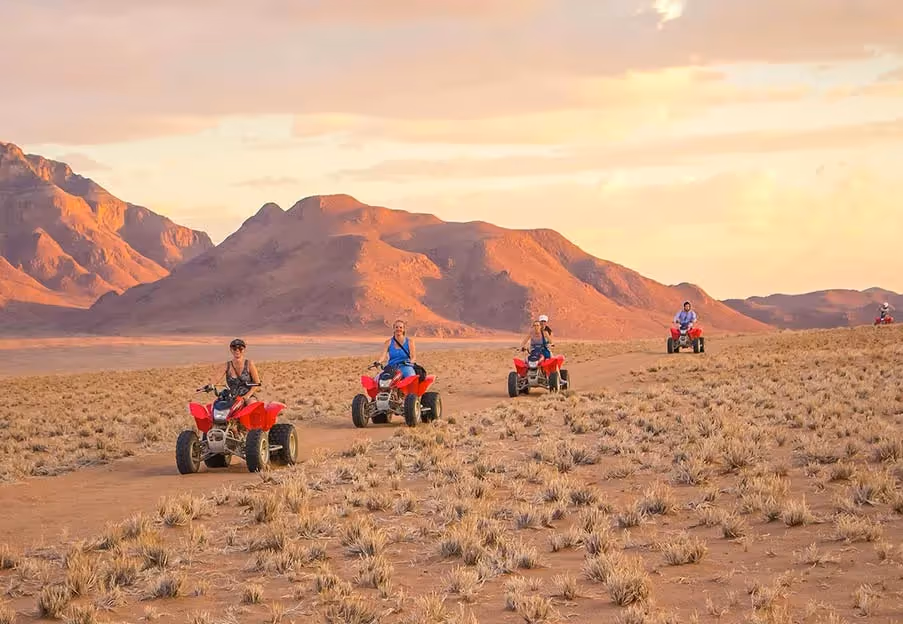 Namibia Tours & Safaris consultants quad biking through the desert
