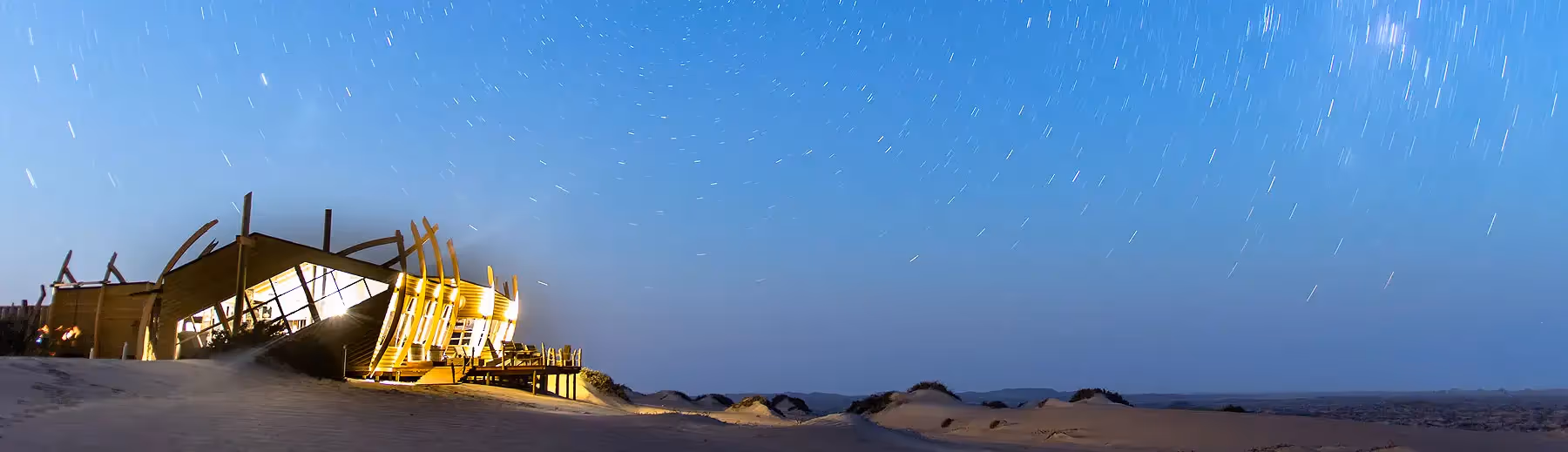 Night time at Shipwreck Lodge, Namibia: this unique shipwreck-inspired lodge, blends adventure and serenity in the coastal landscape.