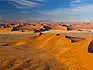 An aerial view over the vast sand dunes of the Namib Desert.