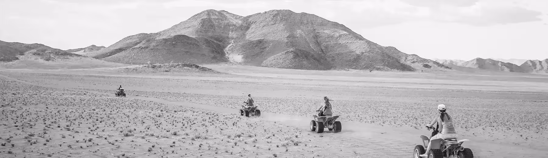 Adventure on wheels: Our consultants embark on a quad biking experience, exploring the terrain on a memorable Namibian adventure.