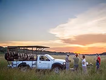 A family enjoying a sundonwer on safari in Zimbabwe. 