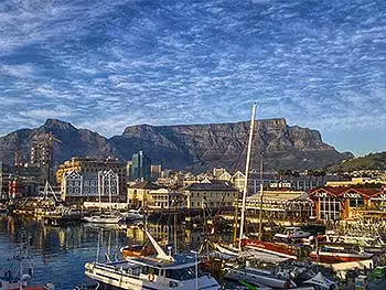 A view of Cape Town harbour from the waterfront with Table Mountain in the background.