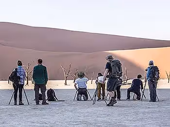 A group of photographers taking pictures in Dead Vlei.