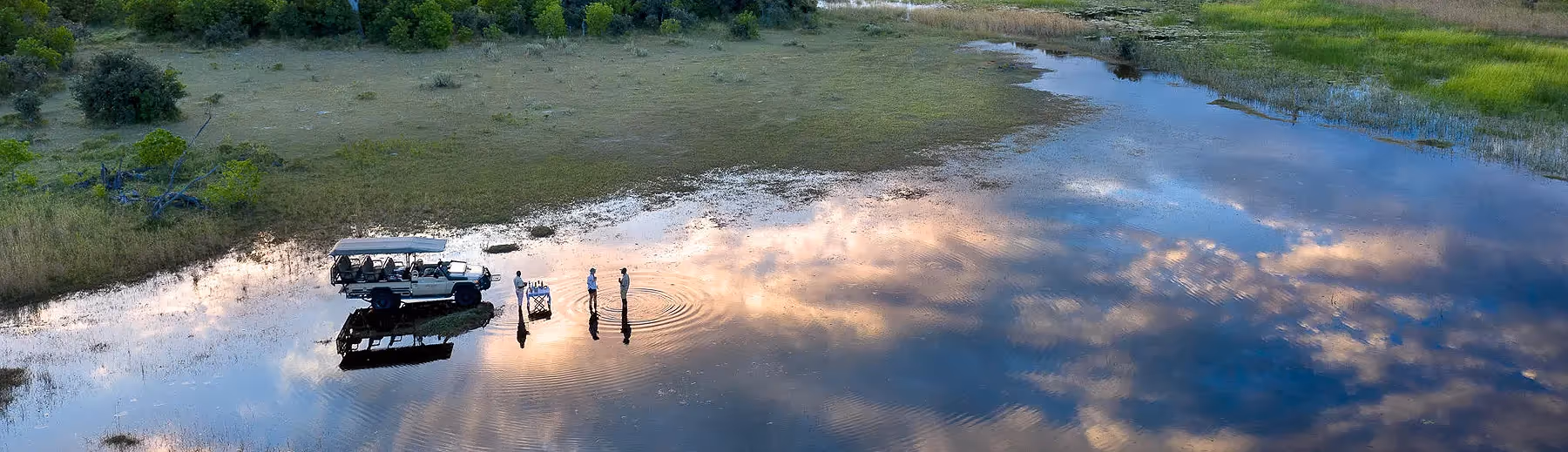 Sundowner bliss: Pause the game drive safari and savour a drink in an unforgettable African setting.